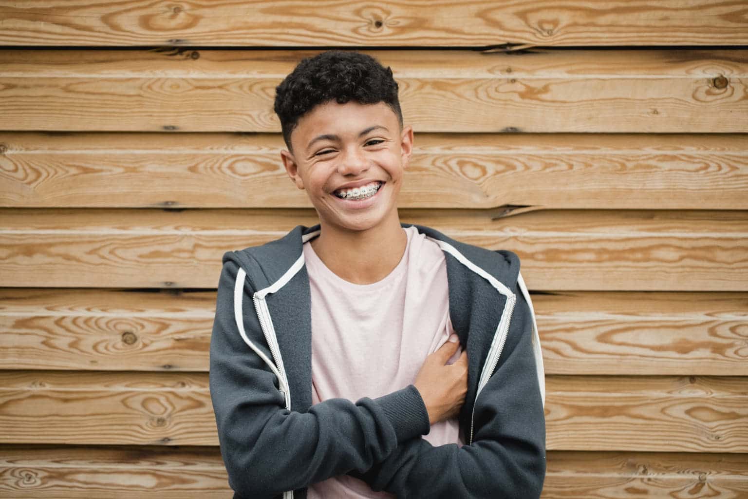 Exuberant teenager with braces and a beaming smile outside in Hendersonville, TN