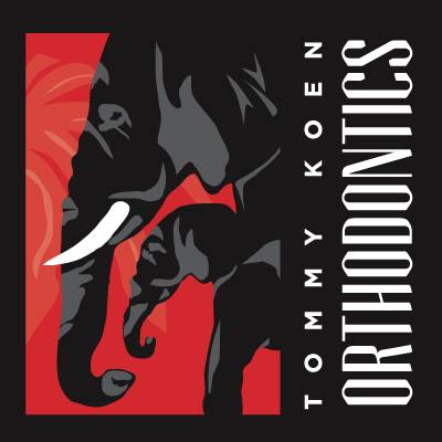 Tommy Koen Orthodontics logo with 2 black elephants against a red background